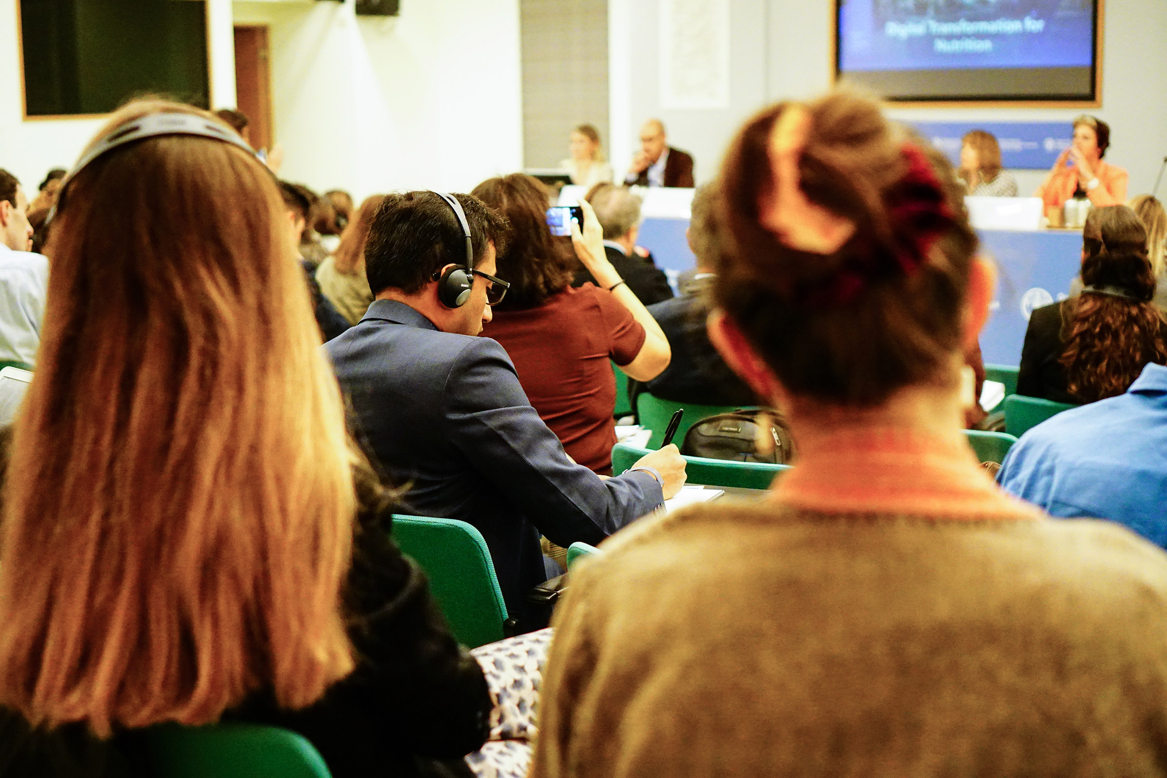 Rohan Agrawal takes notes during the innovation and agroecology side event. He later set up an interview with one of the panelists: the First Lady of Colombia, María Juliana Ruiz Sandoval.